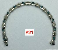 Bracelet laid flat in circular form showing full length and alternating link pattern