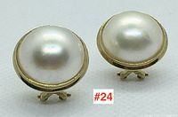 Front view of both earrings showing round mabe pearls and gold bezels