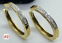 Pair of hoop earrings front angle showing diamond settings