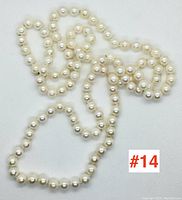 Full strand laid flat to show overall length and bead consistency