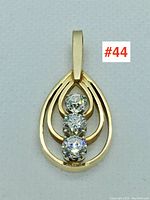 Front view of the pendant showing teardrop shape and three diamonds