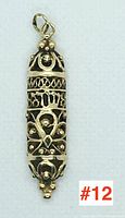 Front view of the 14k gold Judaica mezuzah pendant showing filigree and Hebrew lettering details.