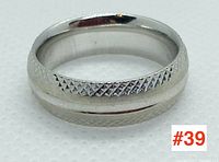 Close-up photo of the 10k white gold ring with textured details on the band, showing front face