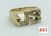 Front side of 14k yellow gold ring featuring initials "JS" with diamonds set across the letters.