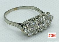 Front angled view showing diamond cluster and band