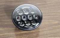 Front view of the 5 3/4 inch round LED motorcycle light showing multiple LED lenses under clear cover.