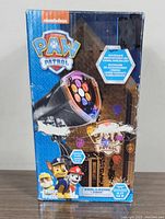 Front of package showing Nickelodeon Paw Patrol branding, Whirl-A-Motion Static device image, and details about light projection capabilities.