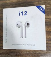 Front of white box showing i12 wireless earbuds image and TWS branding on top right corner