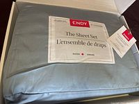 Endy sheet set in original box, showing label with queen size and 300 thread count 100% organic cotton.