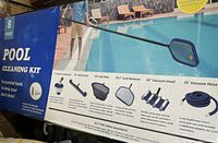 Photo of the pool cleaning kit box displaying 8 included items and a man using the net skimmer at poolside.