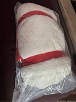 New Tim Hortons stadium blanket in white fleece with red stripes, packed in original plastic.