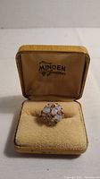 Ring in its original box with Harry Minden Jewellers logo