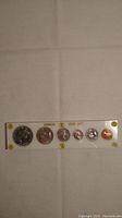 Top view of the mint set coins in acrylic case showing six coins labeled Canada Mint Set