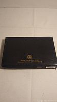 Black box with gold Royal Canadian Mint logo and text on top