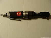 Full view of the Campbell Hausfeld air ratchet showing padded handle and air fitting.
