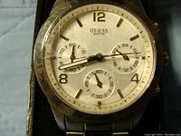 Close-up front view of Guess chronograph watch showing dial with multiple subdials and chronograph functions.