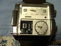 Front view of large square SKMEI watch showing analog clock, digital time/date displays and 24-hour dial.