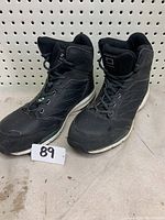 Pair of black Dakota safety shoes with visible wear, showing front and sides.