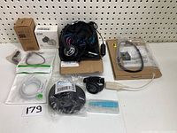 Full lot overview with all items laid out including cables, headset, foam replacements in packaging, wall mount, LED light, and watch light.