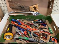 Full box of various hand tools including saws, pliers, screwdrivers, a level, flashlight, and a multi-tool arranged in a Mucci green box