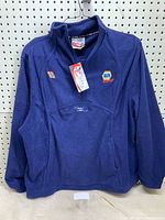 Front view of navy fleece pullover with NAPA Racing logo, number 16, and Michael Waltrip embroidery.