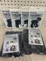 Five black neck gaiters displayed packaged on shelf with visible Eanover branding and product information.