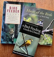 Three birding books including one hardcover and two paperbacks, with the audio CD included.