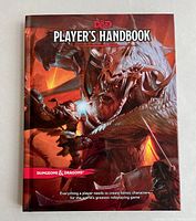 Front cover of the Dungeons & Dragons Player's Handbook showing fantasy battle artwork and title text.