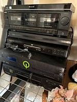 Stacked view of Panasonic double cassette tape deck on top, Technics amplifier below, plus two other components visible at bottom