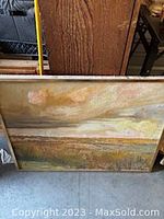 Front view of mid-century landscape painting showing sky and horizon with wood frame