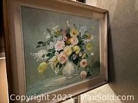 Framed floral painting with pastel pink, yellow, and white flowers in white vase