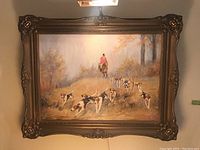 Frontal view of full framed painting with light fixture mounted above