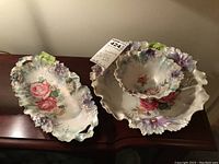 Three pieces displayed together on wood surface: two bowls and one tray