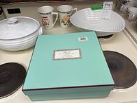 All five items on stovetop: two mugs, large boxed bowl, open and covered White Oak bowls