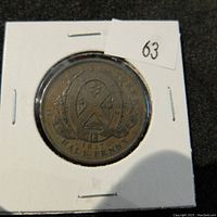 Obverse side of the 1837 Province of Canada halfpenny token showing shield emblem and text.