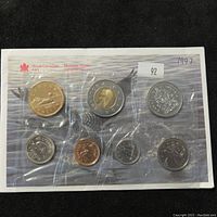First sealed card showing 8 Canadian coins in various denominations with Royal Canadian Mint logo.