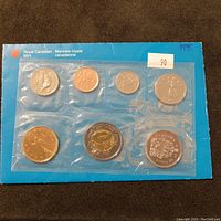 Royal Canadian Mint 1999 sealed uncirculated coin set in original blue card packaging. Six coin slots visible with various coins.