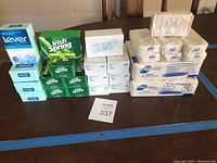 Full lot arrangement of all 36 bars including Lever, Irish Spring, Zest and Dial soaps stacked on a table.