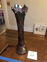 Tall view of the Fenton carnival glass vase showing full body, rustic texture, and wavy rim.