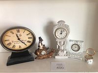 Front view of Liverpool Street Station clock, monkey on snail ceramic clock, white ornate Tempes digit enamel clock, Waterford crystal rose clock, small round enamel clock trinket box