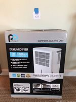Front view of the Perfect Aire dehumidifier box showing product features, model number 4PAD30, and specifications including 30 pint capacity and 1500 sq. ft. coverage.