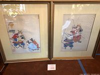 Pair of framed silk screen paintings depicting Japanese samurai warriors, placed side by side showing traditional armor and historical scene with cream mats and gold frames.
