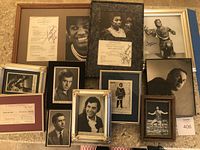 Overview of nine framed items on floor