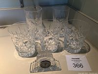 Overview of all glasses and the small waterford crystal clock on display.