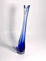 Full view of tall vintage Mid-Century Modern style swung vase. Clear glass body with blue coloring transitioning from base upward, organic flared top edge.