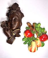 Vintage chalkware Geisha woman wall hanging and colorful fruit motif side by side showing size and details