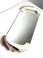 Full view of rectangular mirror tray showing the mirror surface and curved handles at the shorter sides in cream, pink, and burgundy with gold trim.