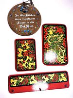 Round wood wall hanging with the 1970s kitchen saying and colorful folk art flowers and birds