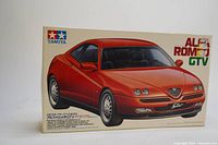 Front box image showing red Alfa Romeo GTV car model with Tamiya branding and product details.