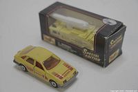 Yellow Majorette Ford Sierra die cast toy car with red and orange stripes